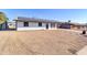 Modern, single-story home with a clean, minimalist design and solar panels at 729 N 96Th Pl, Mesa, AZ 85207