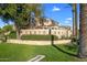 Canyon Gate community exterior featuring Spanish-style architecture and lush landscaping at 7887 N 16Th St # 116, Phoenix, AZ 85020