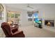 Bright living room features a fireplace and access to a private patio at 7887 N 16Th St # 116, Phoenix, AZ 85020