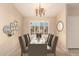 Elegant dining room with a table set for six, ready to host dinner parties at 8729 W Tuckey Ln, Glendale, AZ 85305