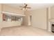 Living room with kitchen views, breakfast bar and fireplace at 8729 W Tuckey Ln, Glendale, AZ 85305