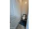 Small half bathroom with toilet and simple sink at 900 S Canal Dr # 204, Chandler, AZ 85225