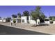 House exterior with a two-car garage and desert landscaping at 9732 E Minnesota Ave, Sun Lakes, AZ 85248