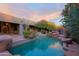 Inviting pool with a waterfall and natural rock features at 10040 E Happy Valley Rd # 204, Scottsdale, AZ 85255