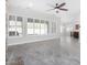 Bright living area with gray tile floors and large windows at 12374 S 181St Dr, Goodyear, AZ 85338