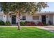 Ranch style home exterior, featuring a lush lawn and mature tree at 13687 N Garden Court Dr, Sun City, AZ 85351