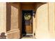 Wood front door with iron accents and a festive wreath at 1450 E Buena Vista Dr, Chandler, AZ 85249