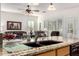 Kitchen island with granite countertops and double sink overlooking living room at 1450 E Buena Vista Dr, Chandler, AZ 85249