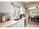 Modern kitchen with white cabinets, quartz counters, and stainless steel appliances at 15095 N Thompson Peak Pkwy # 1016, Scottsdale, AZ 85260