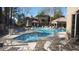 Community pool and spa with lounge chairs and patio furniture at 15095 N Thompson Peak Pkwy # 1016, Scottsdale, AZ 85260