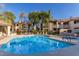 Community pool and spa area with lush landscaping at 15095 N Thompson Peak Pkwy # 1016, Scottsdale, AZ 85260