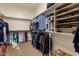 Large walk-in closet with ample hanging and shelving space at 16488 W Wilshire Dr, Goodyear, AZ 85395