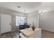 Kitchen island with four chairs and view of exterior window at 17717 W Port Royale Ln, Surprise, AZ 85388