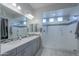 Elegant bathroom with double sinks, large shower, and modern finishes at 18704 N Cook Dr, Maricopa, AZ 85138