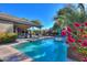 Inviting backyard oasis featuring a sparkling pool and relaxing patio at 18704 N Cook Dr, Maricopa, AZ 85138