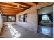 Sunroom with brick walls, wood ceiling, and views of the surrounding area at 1907 E Foothill St, Apache Junction, AZ 85119