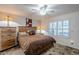 Spacious bedroom with rustic wood accents and a ceiling fan at 2354 S Buttercup --, Mesa, AZ 85209