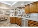 Kitchen with granite island and wooden cabinets at 2354 S Buttercup --, Mesa, AZ 85209