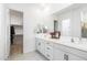 Elegant bathroom with double vanity and walk-in closet at 28722 N 133Rd N Ln, Peoria, AZ 85383