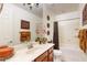 Bathroom with tub, shower, vanity, and decorative accents at 30855 N 138Th Ave, Peoria, AZ 85383