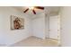 Bedroom with double door closet and ceiling fan at 30855 N 138Th Ave, Peoria, AZ 85383