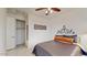 Well-lit bedroom with double closets and ceiling fan at 30855 N 138Th Ave, Peoria, AZ 85383