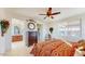 Spacious bedroom with ensuite bathroom access and ceiling fan at 30855 N 138Th Ave, Peoria, AZ 85383