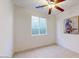 Small bedroom with ceiling fan and large wall art at 30855 N 138Th Ave, Peoria, AZ 85383
