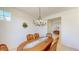 Bright dining room, featuring a large table and chandelier at 30855 N 138Th Ave, Peoria, AZ 85383