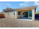 Rear view of house showing patio and sliding doors at 30855 N 138Th Ave, Peoria, AZ 85383