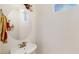 Small half bathroom with pedestal sink and round mirror at 30855 N 138Th Ave, Peoria, AZ 85383