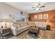 Spacious living room with sectional sofa and a coffee table at 358 E Goldmine Ct, San Tan Valley, AZ 85140