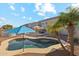 Private pool with patio chairs and umbrellas at 358 E Goldmine Ct, San Tan Valley, AZ 85140