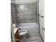 Bathroom with a shower/tub combo and updated tile at 3753 S Mill Ave, Tempe, AZ 85282