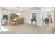 Dining room with a wooden table, chandelier, and view to the patio at 3931 N Golf Dr, Buckeye, AZ 85396