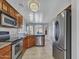 Kitchen with stainless steel appliances and wood cabinets at 533 S 230Th Ave, Buckeye, AZ 85326