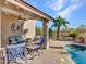 Covered patio with comfortable seating overlooking the pool at 533 S 230Th Ave, Buckeye, AZ 85326