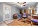 Living room featuring hardwood floors, and a view of the kitchen at 701 S Dobson Rd # 421, Mesa, AZ 85202