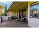 Relaxing patio with wicker furniture and string lights, offering an outdoor oasis at 7622 E Vista Dr, Scottsdale, AZ 85250