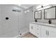 Modern bathroom with double vanity, large shower, and stylish fixtures at 7701 N 17Th Ave, Phoenix, AZ 85021