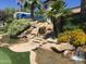 Landscaped waterfall and pond with stone accents at 7750 E Broadway Rd # 822, Mesa, AZ 85208