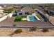 Single-story home with pool, pergola, and artificial turf at 8424 N 194Th Dr, Waddell, AZ 85355