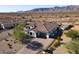 Single-story home with tile roof, pool, and desert landscape; mountain views at 8424 N 194Th Dr, Waddell, AZ 85355