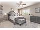 Spacious bedroom with plush bedding, large window, and gray dresser at 860 N Mcqueen Rd # 1190, Chandler, AZ 85225