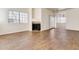 Living room featuring a fireplace and wood-look tile floors at 930 N Mesa Dr # 1097, Mesa, AZ 85201