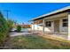 Side view of house showcasing patio and pool area at 941 E 10Th Pl, Mesa, AZ 85203