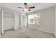 Well-lit bedroom featuring a large window and dual closets at 962 W Keating Ave, Mesa, AZ 85210