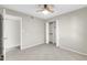 Bedroom with ceiling fan and tile flooring, plus closet at 962 W Keating Ave, Mesa, AZ 85210