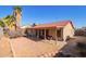 Backyard patio with seating area and gravel ground cover at 10096 N 63Rd Ave, Glendale, AZ 85302