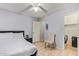 Spacious bedroom with a queen bed, closet, and ceiling fan at 10096 N 63Rd Ave, Glendale, AZ 85302